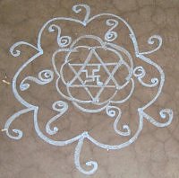 A simple star based kolam rangoli design in chalk